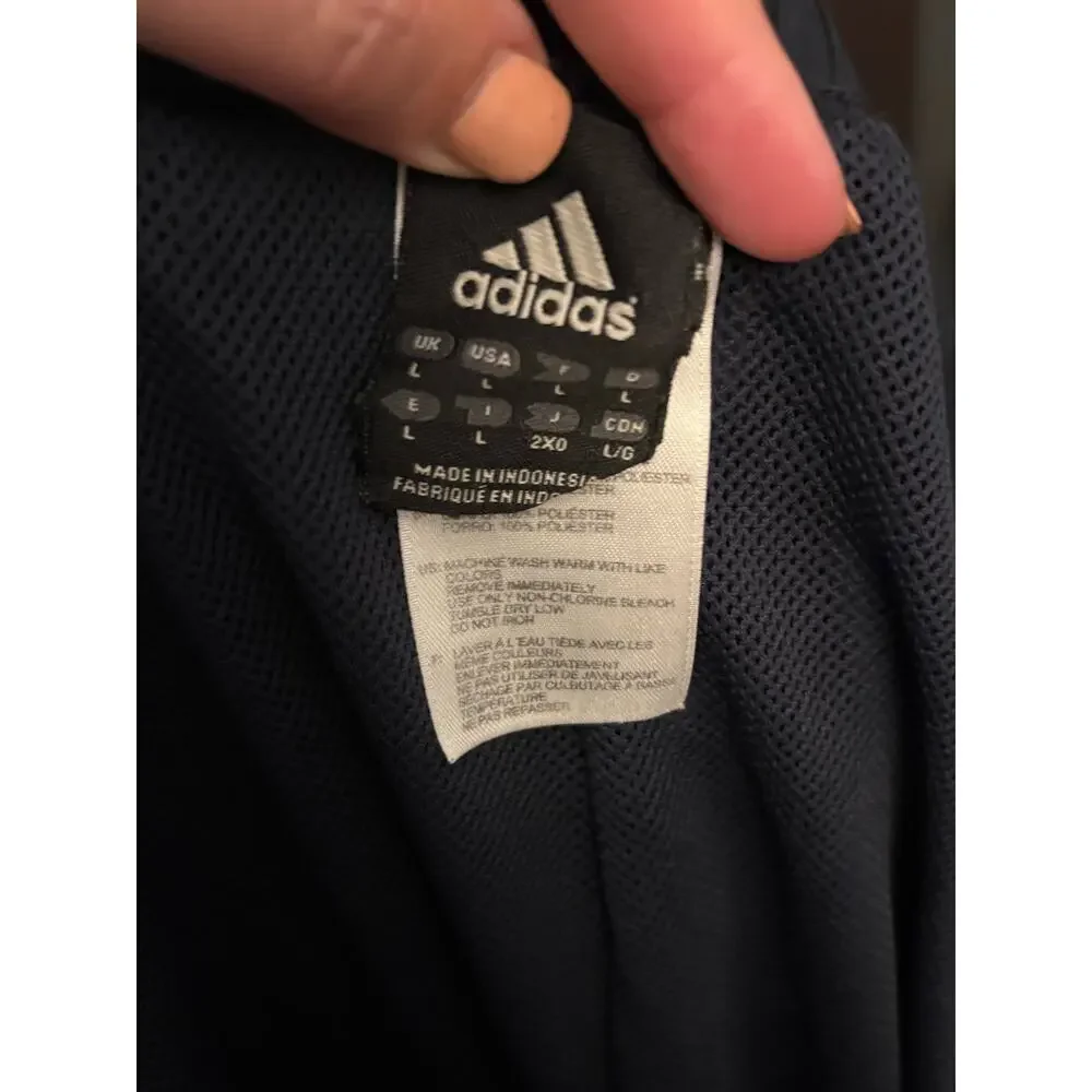 Men’s Adidas black track style pants with mesh lining